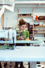 Dressmaker working in her atelier