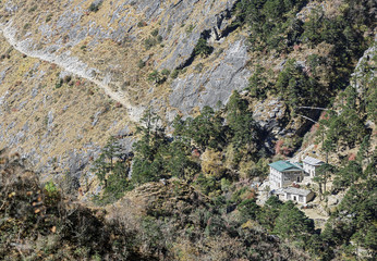 Ancient Buddhist stupa on the path at the entrance to the Phortse village - Everest region, Nepal,...