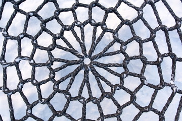 Naklejka premium Rope texture of an swing chair in the snow