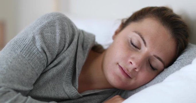 Young adult female waking up in the morning
