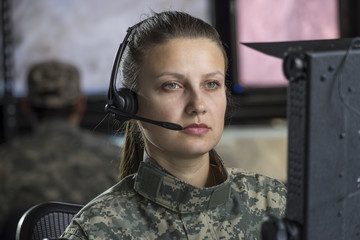 Female drone operator working at computer