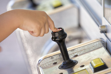 Hand of child pressing button