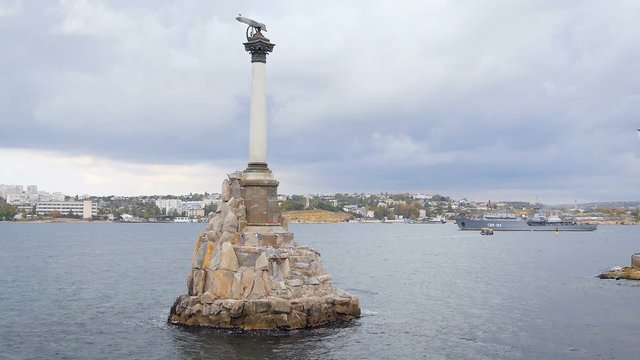 Monument to the Scuttled Ships Towering Over the City in Sevastopol. the Symbol of the City. in the Background is a Warship