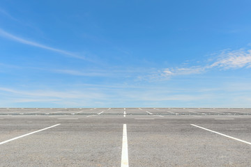 Empty parking lot on blue sky background © yotrakbutda