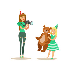 Woman Taking Pictures With Girl And Teddy Bear, Kids Birthday Party Scene With Cartoon Smiling Character