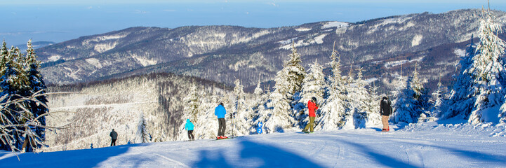 Winter in mountain, Skiers on slope. 