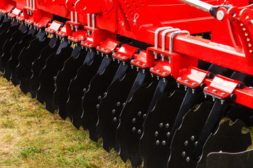 Detailed closeup of disc harrow agricultural machinery