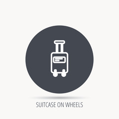 Suitcase with wheels icon. Travel baggage sign. Round web button with flat icon. Vector