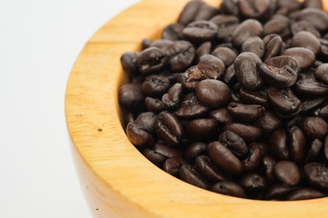 Coffee beans in wooden bowl