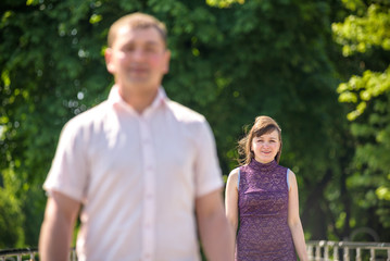 Fototapeta premium Loving young couple walk on the park at summer.
