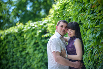 Fototapeta premium Loving young couple walk on the park at summer.