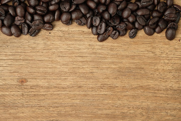 Old coffee bean on wooden with copy space