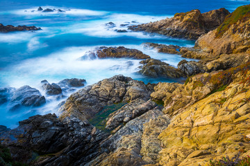 Fototapeta na wymiar Big Sur California coast ocean meeting rocky cliff land travel destination