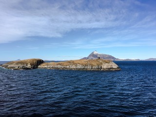 Arctic circle statue on the Norwegian coast. Vikingen Island is a island in Nordland, Norway. It is notable for having the Arctic Circle pass through it, something that is marked by a small statue.