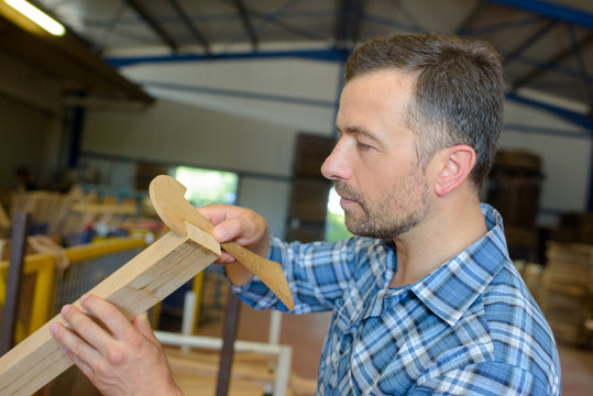 Carpenter measuring wood