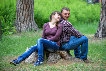 Fototapeta premium Loving young couple walk on the park at summer.