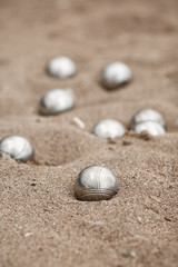 Fototapeta na wymiar Bocce petanque balls on sand beach