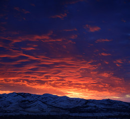 Sunset with Mountains in Wilderness Sky Clouds