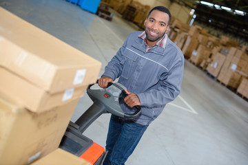 warehouse worker with pushcart