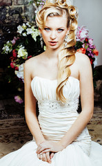 beauty young bride alone in luxury vintage interior with a lot of flowers close up