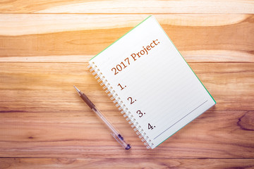 Top view year 2017 with notebook on wooden desk