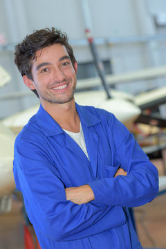 Portrait Of Man In Blue Overalls