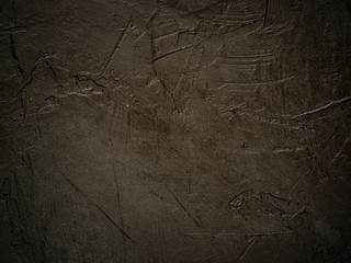 Dark grunge textured wall closeup