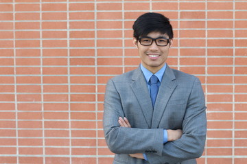 Confident modern business man with arms crossed