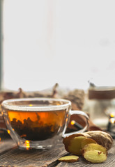Transparent Cup of tea on wooden background