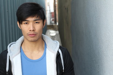 Attractive Asian man close up portrait with copy space 