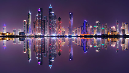 Amazing night panorama of Dubai Marina. Multiple highest skyscrapers of the world with residential buildings, Dubai, United Arab Emirates