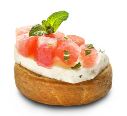 watermelon and halloumi cheese on a dakos