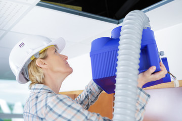 dirty filter of air conditioner in female hands