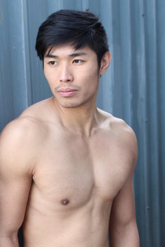 Sensuous Asian man shirtless close up