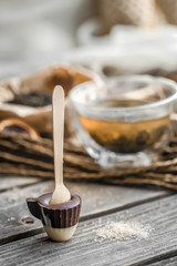 tea and chocolate candy on a stick