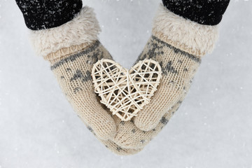 Rattan heart in hands