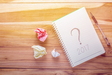 Top view year 2017 with notebook on wooden desk