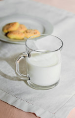 Obraz na płótnie Canvas cookies and milk are on a white tablecloth