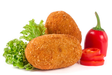 two fried breaded cutlet with lettuce isolated on white background