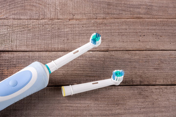 Electric Toothbrush on an old wooden background