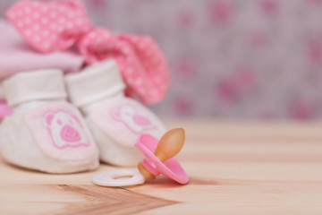 Its a Girl pink theme Baby Shower or Nursery background with decorated borders on wood background.