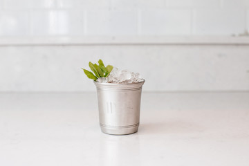 Mint julep cocktail in silver glass
