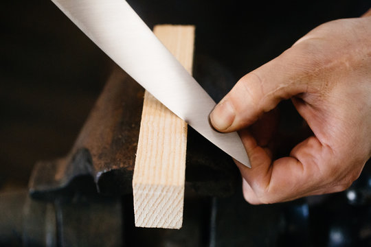 Person Cutting Wood With Knife Blade, Close-up