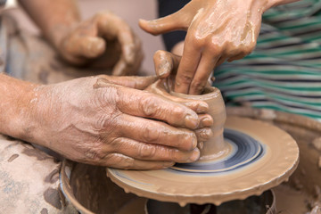 Pottery making, close up on hands