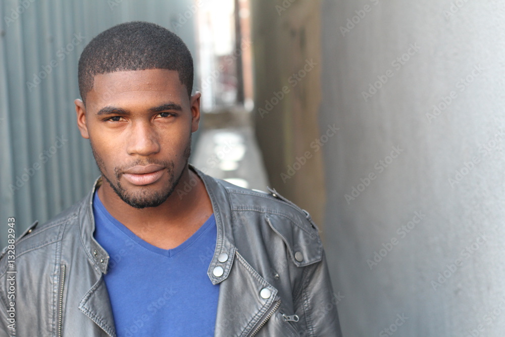 Wall mural Close-up of handsome young, dark-skinned man