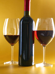 on the table a bottle of wine and glass