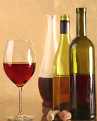 on the table a bottle of wine and glass