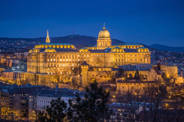 Budapest, Hungary - The beautiful Buda Castle (Royal Palace) as seen from Gellert Hill illuminated in winter time at blue hour