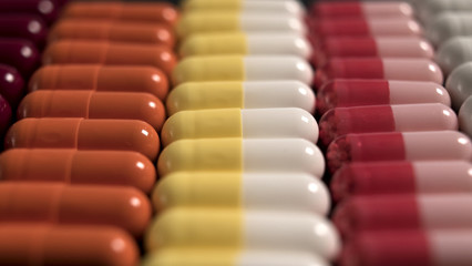 Obraz premium multicolored capsules neatly stacked in a row