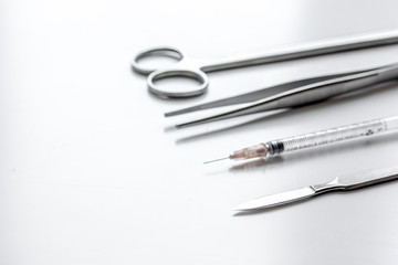 instruments for plastic surgery on white background